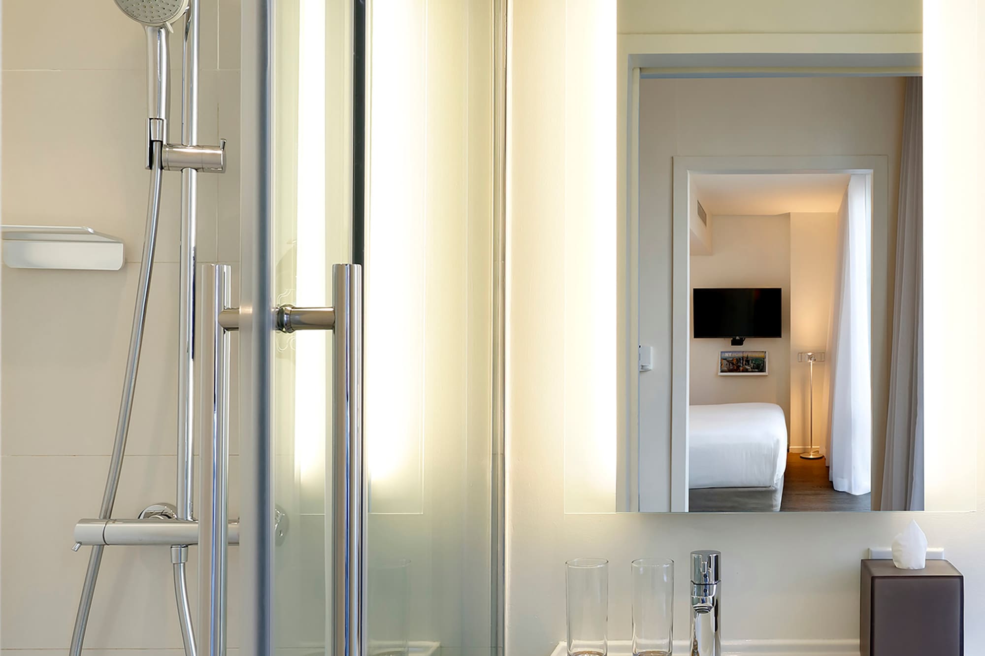 a bathroom with a shower and a mirror