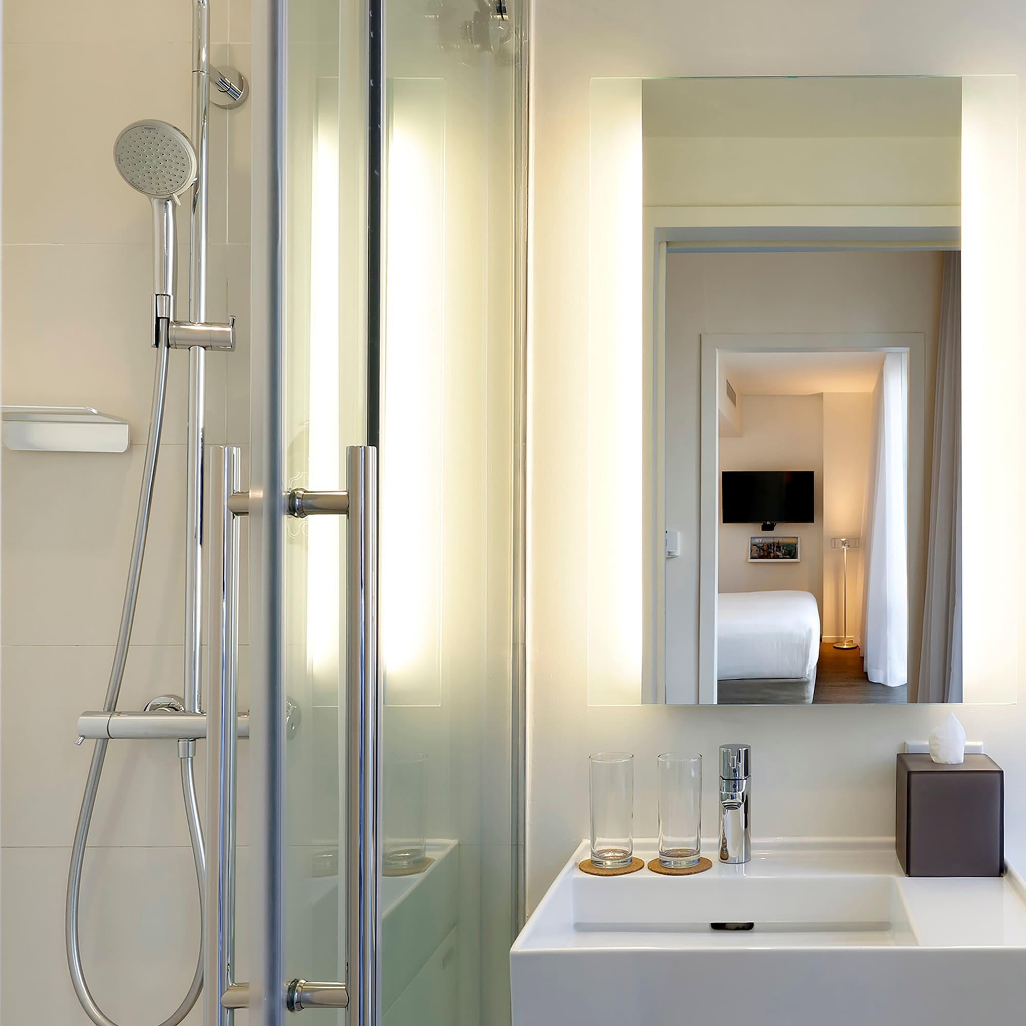 a bathroom with a shower and a mirror