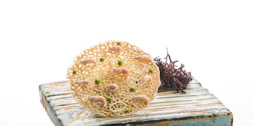 a small round object on a wood surface