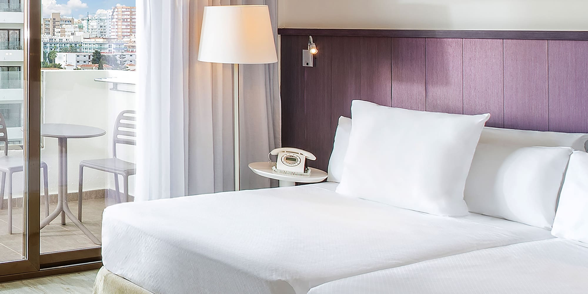 a hotel room with a glass door