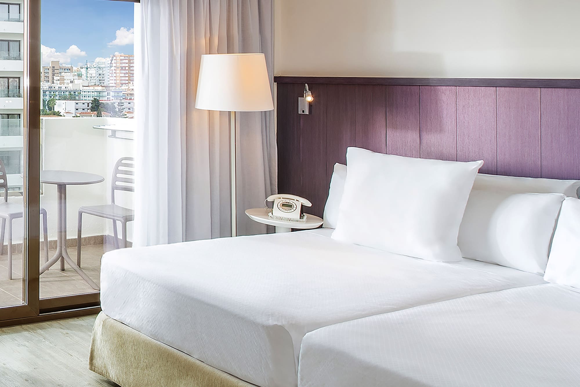 a hotel room with a glass door