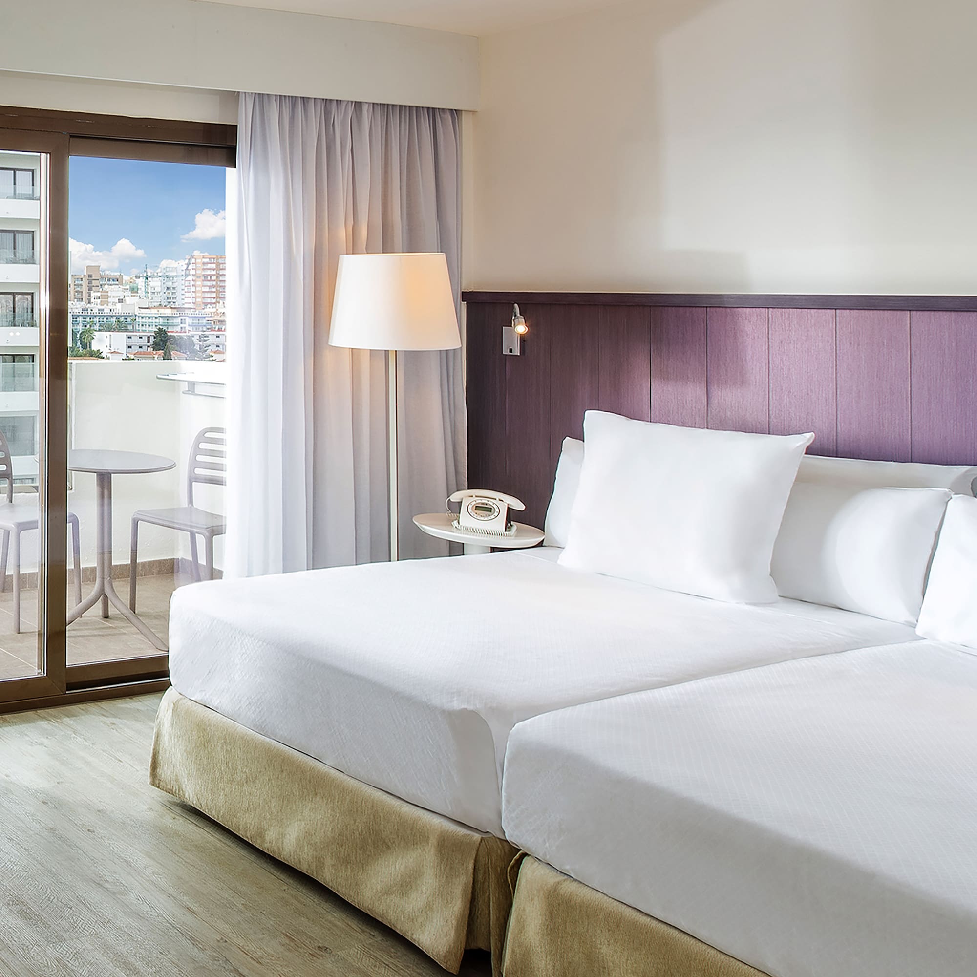 a hotel room with a glass door