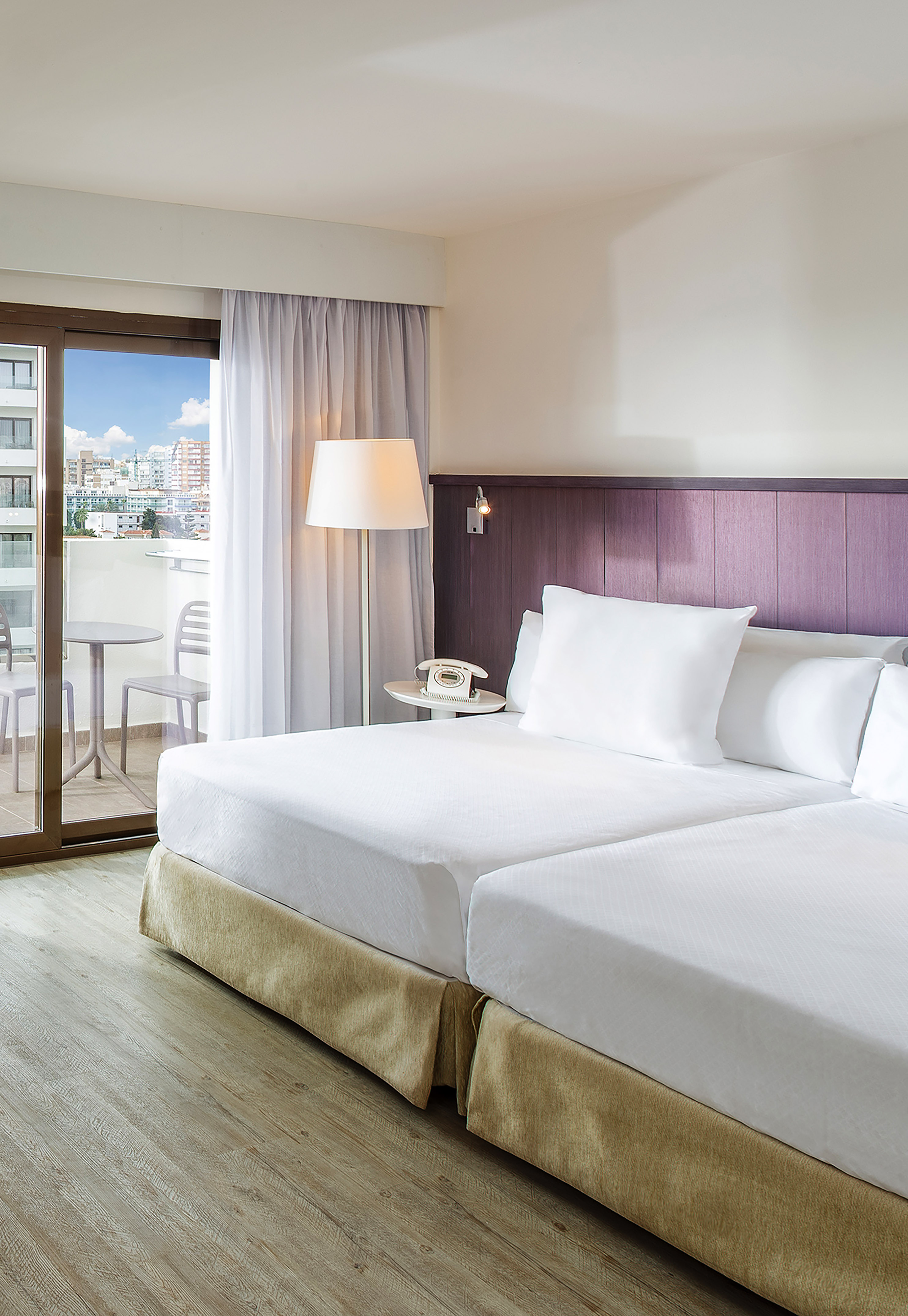 a hotel room with a glass door