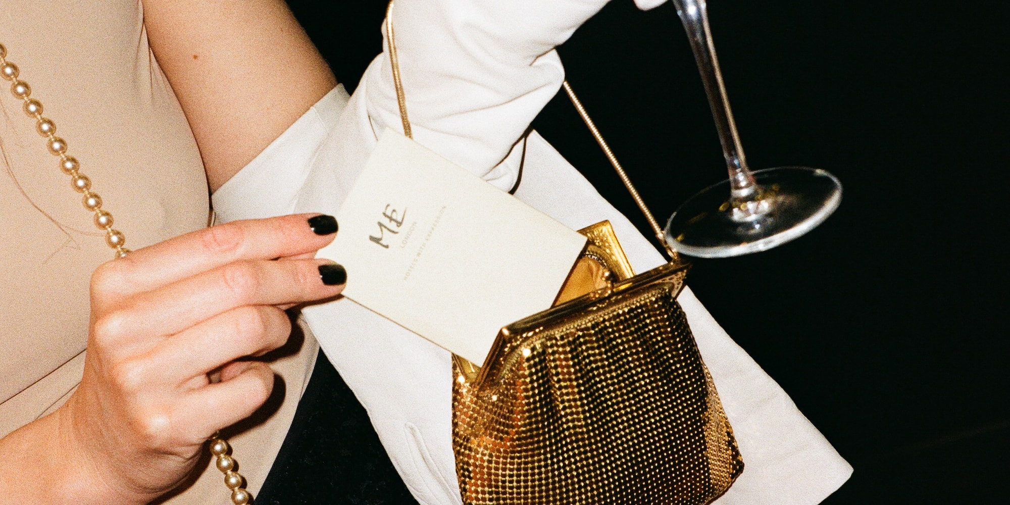 a woman holding a glass of wine