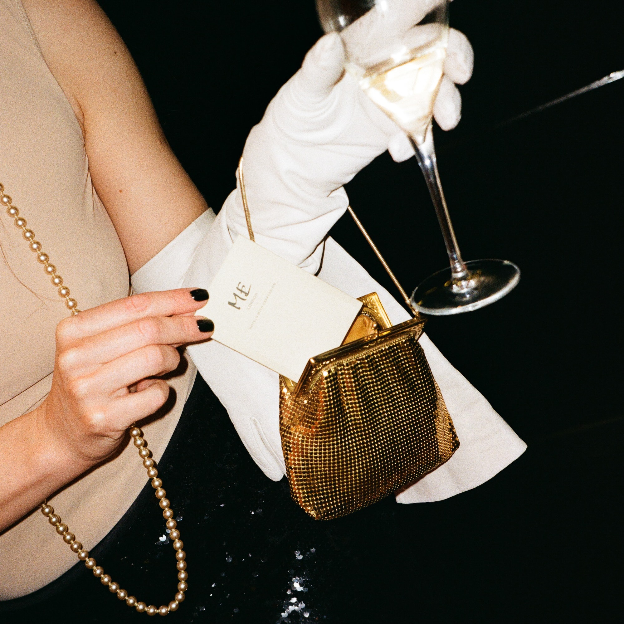 a woman holding a glass of wine