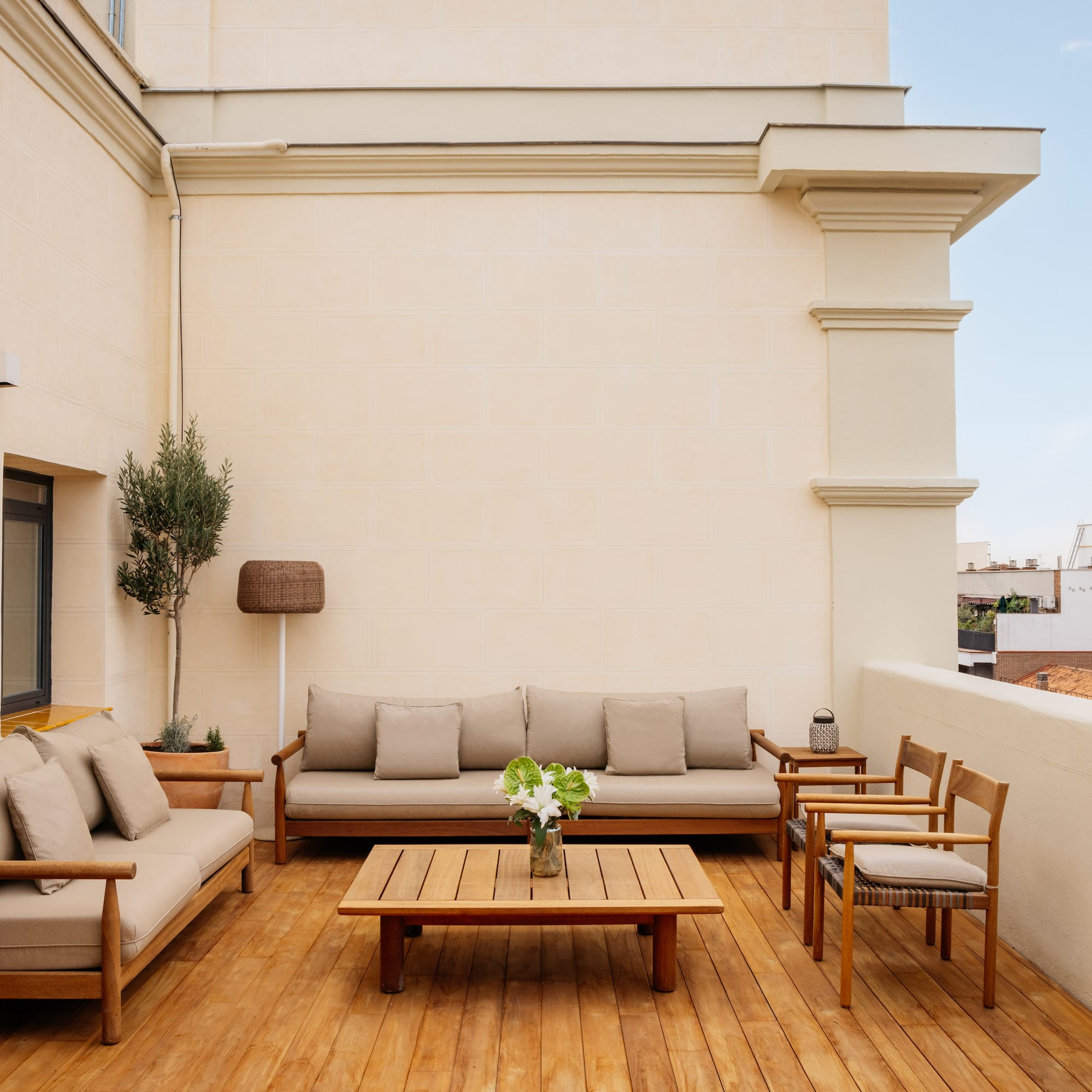 a patio with a table and chairs