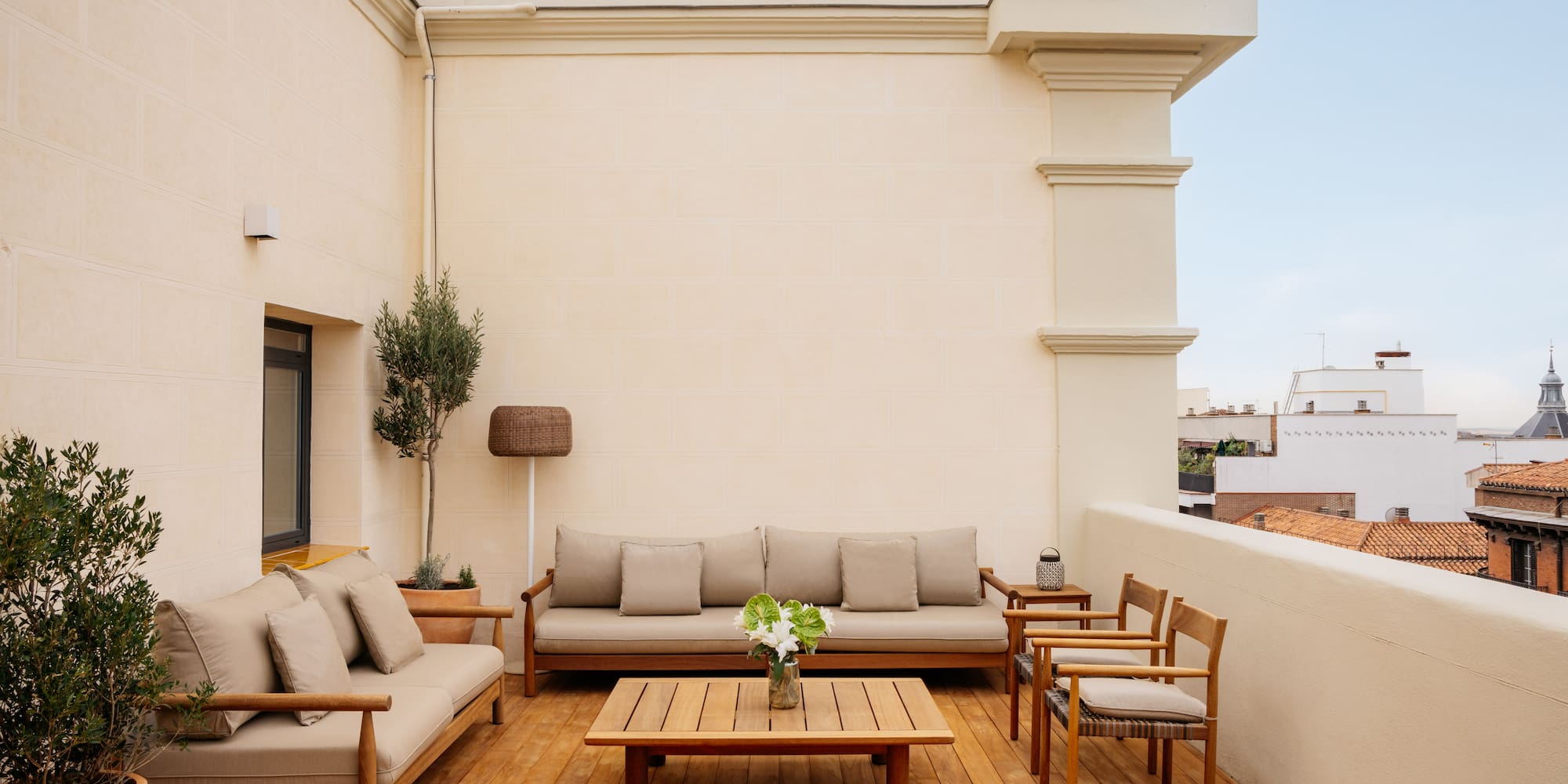 a patio with a table and chairs