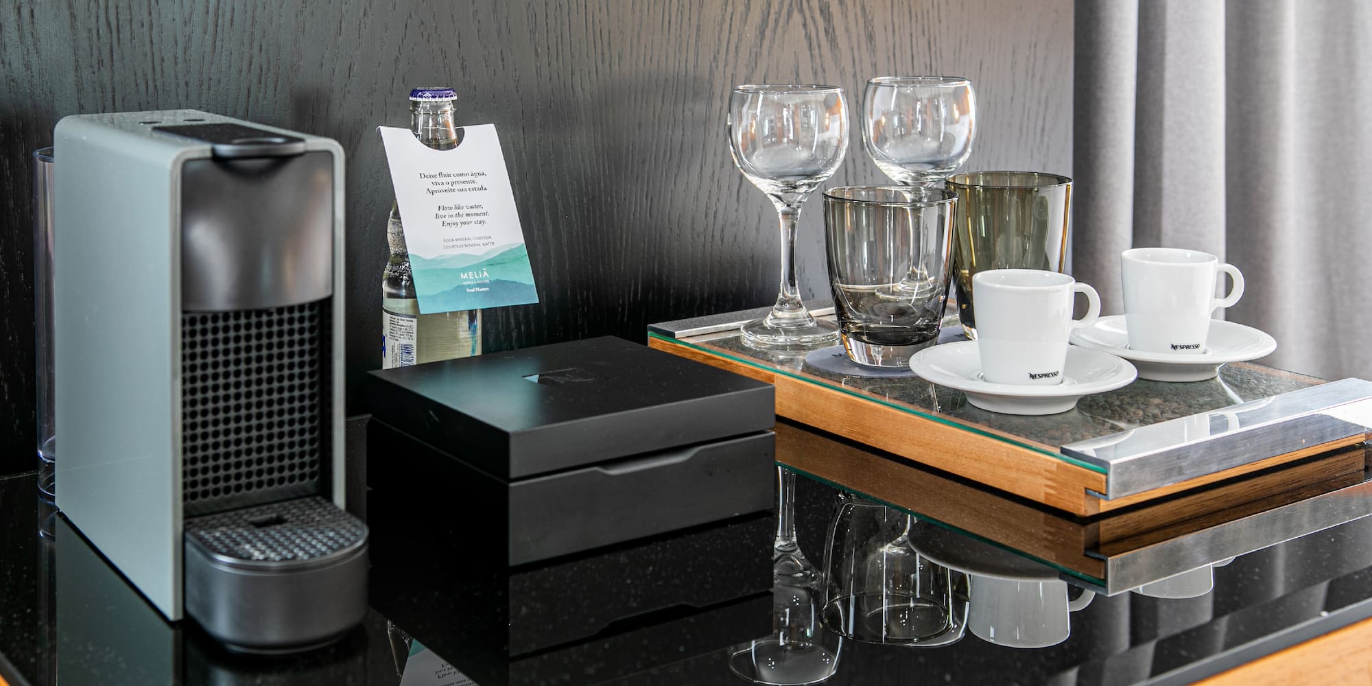 a coffee machine and glasses on a table