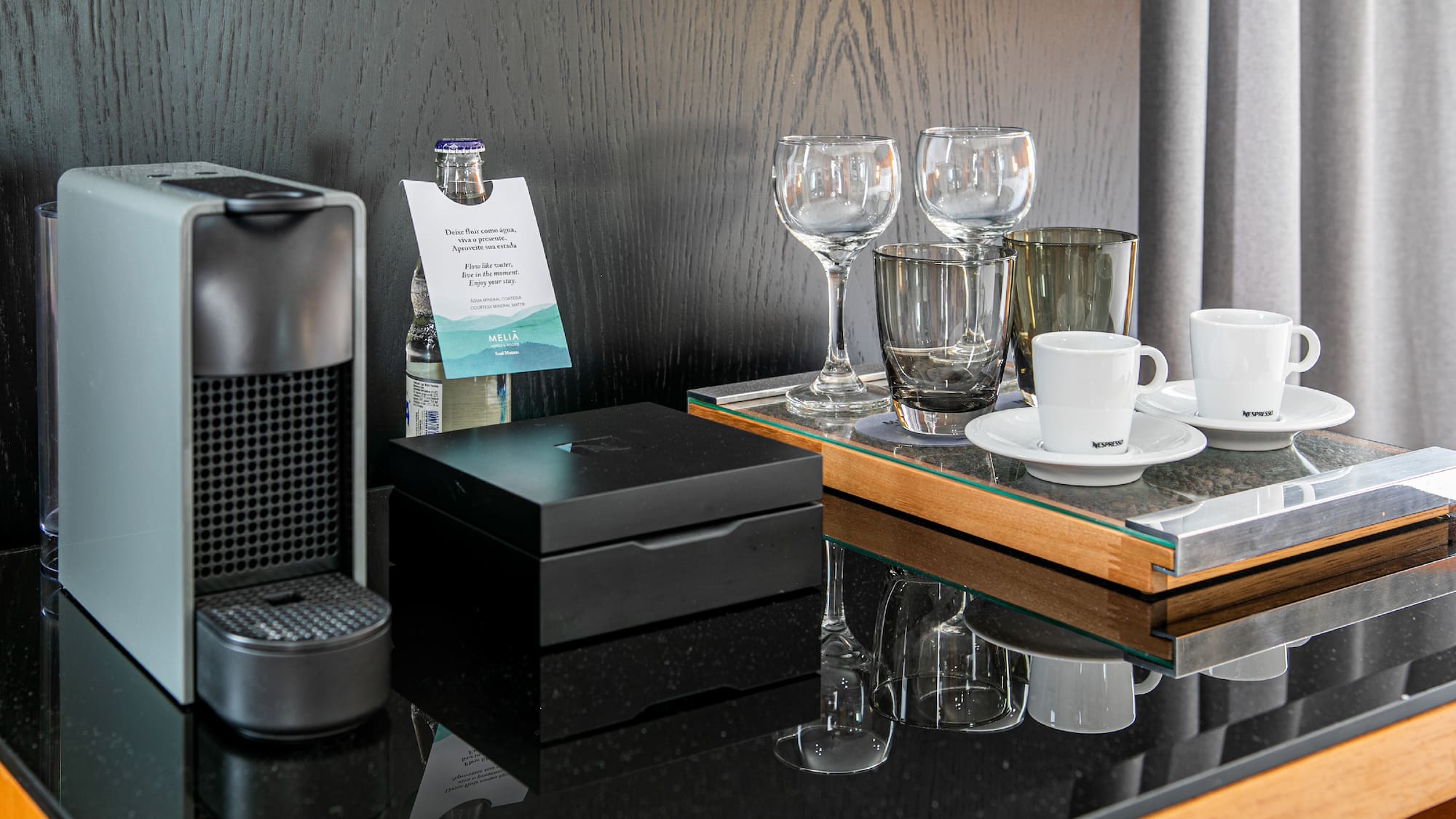 a coffee machine and glasses on a table