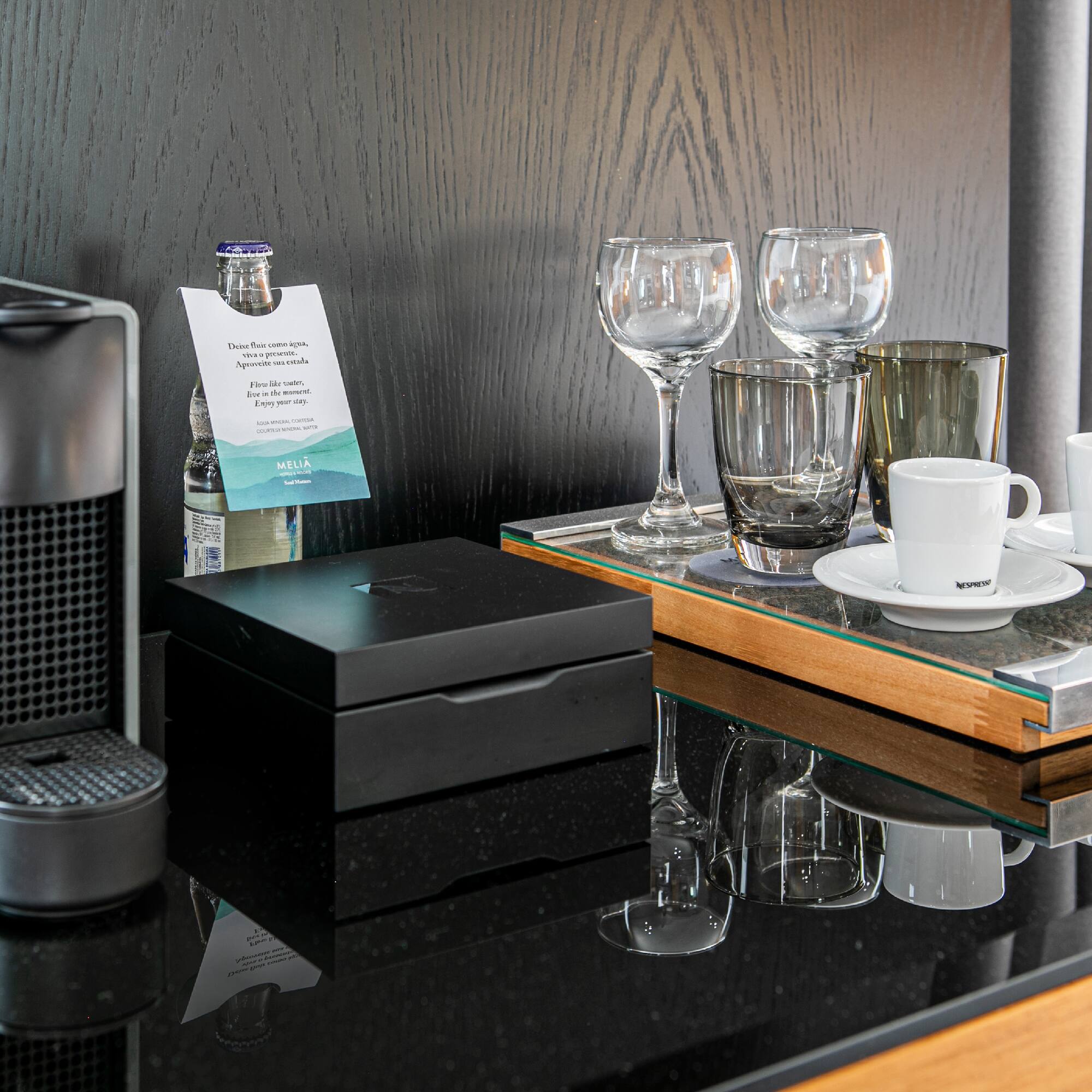 a coffee machine and glasses on a table
