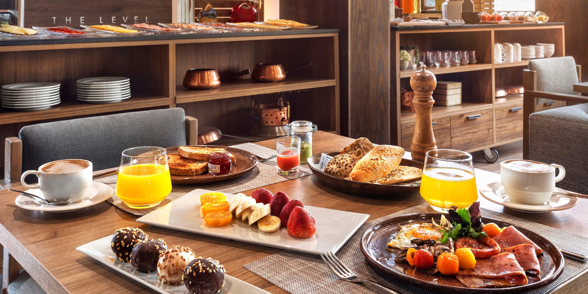 a table with plates of food and drinks