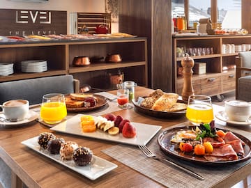 a table with plates of food and drinks