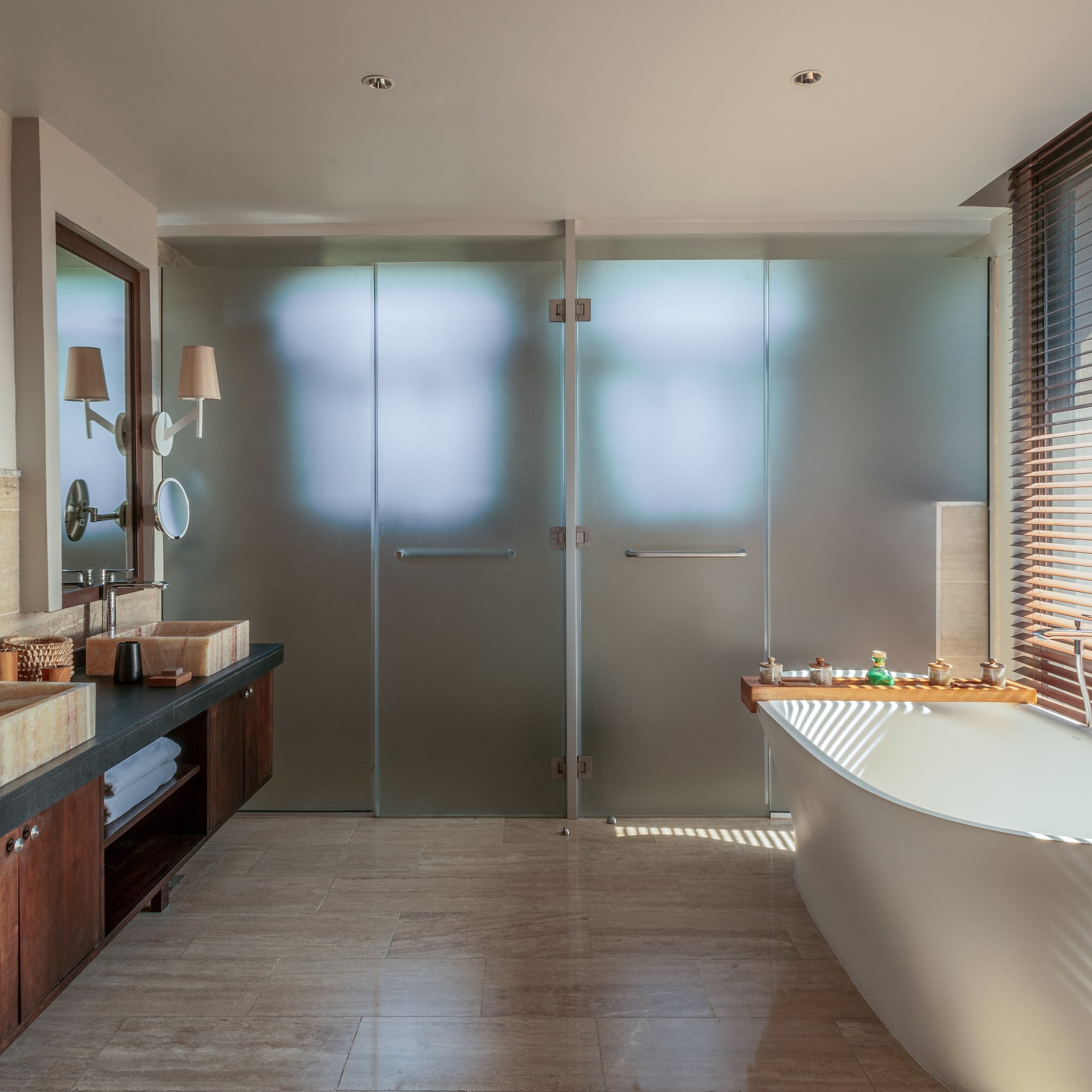 a bathroom with a tub and sink