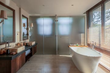 a bathroom with a tub and sink