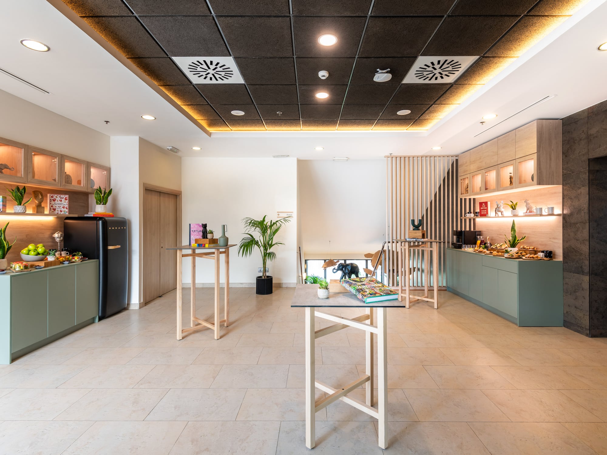 a room with a black ceiling and a white tile floor
