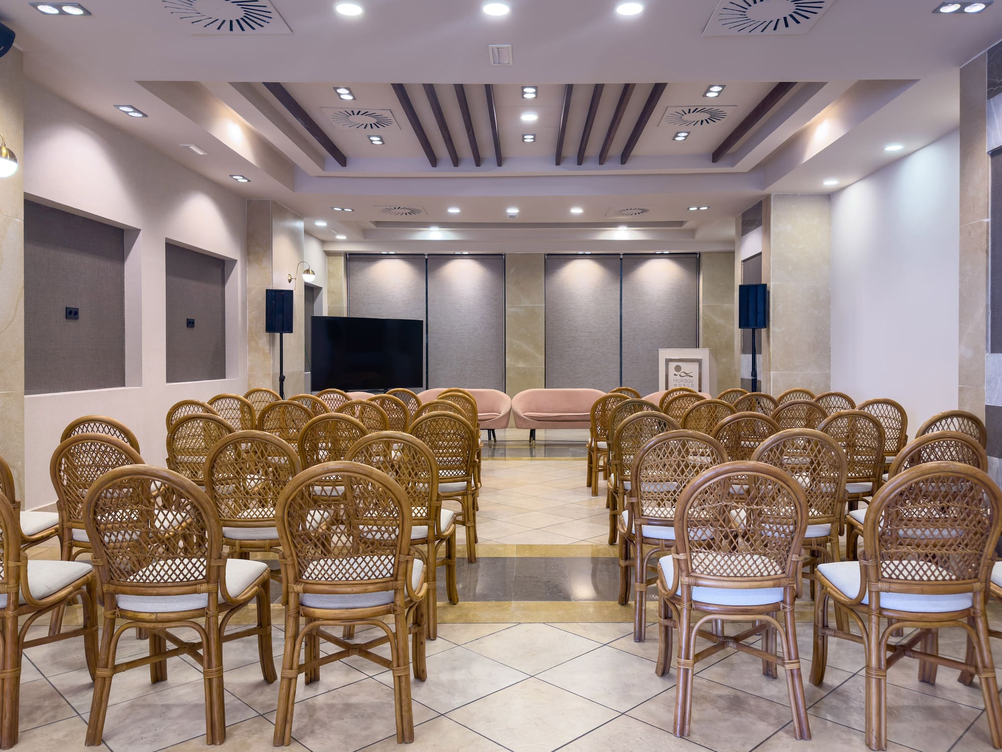 a room with chairs and a television