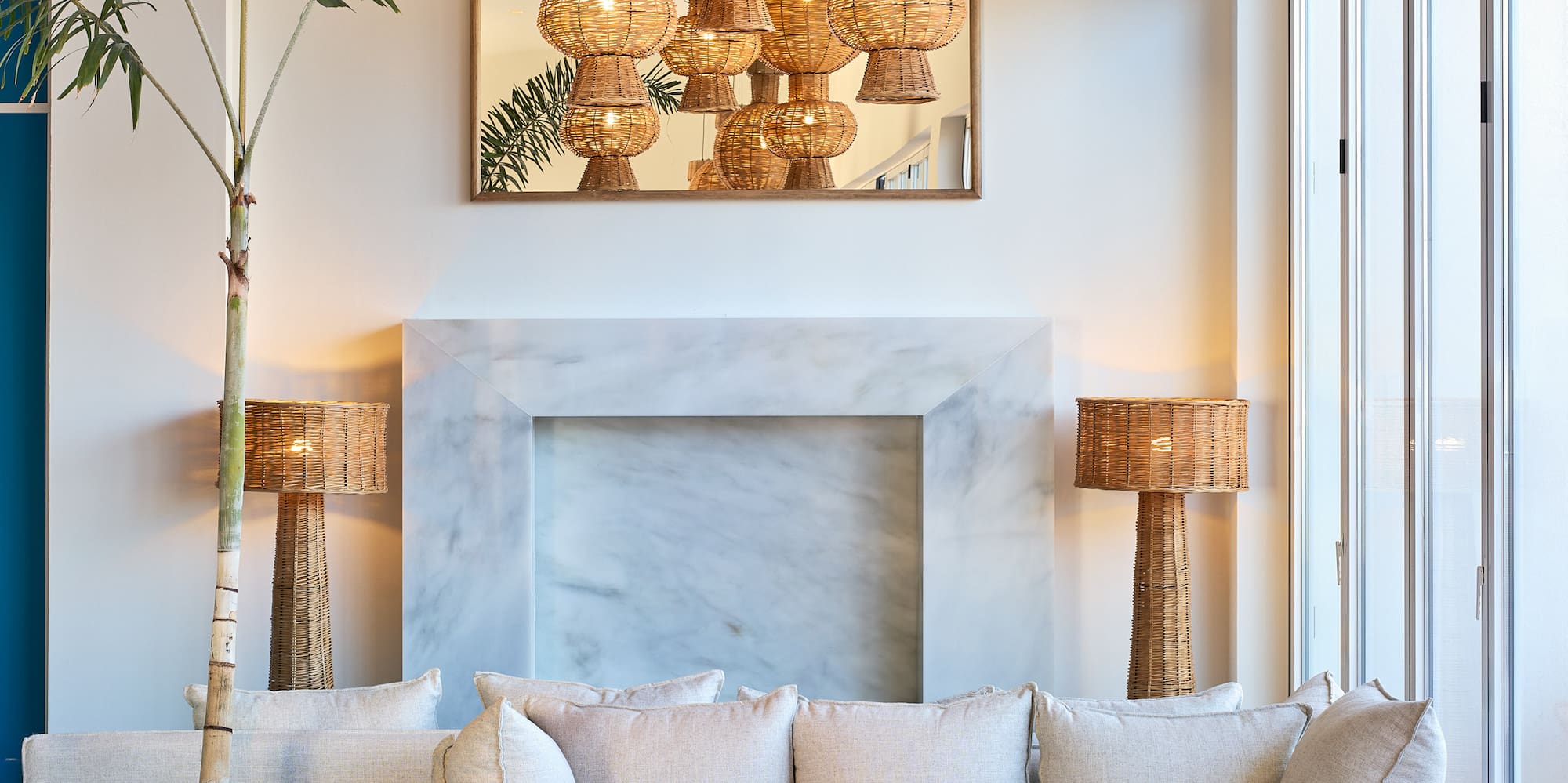 a room with a couch and a fireplace