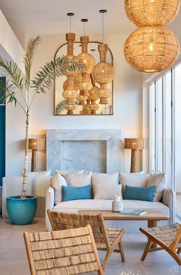 a room with a couch and a fireplace