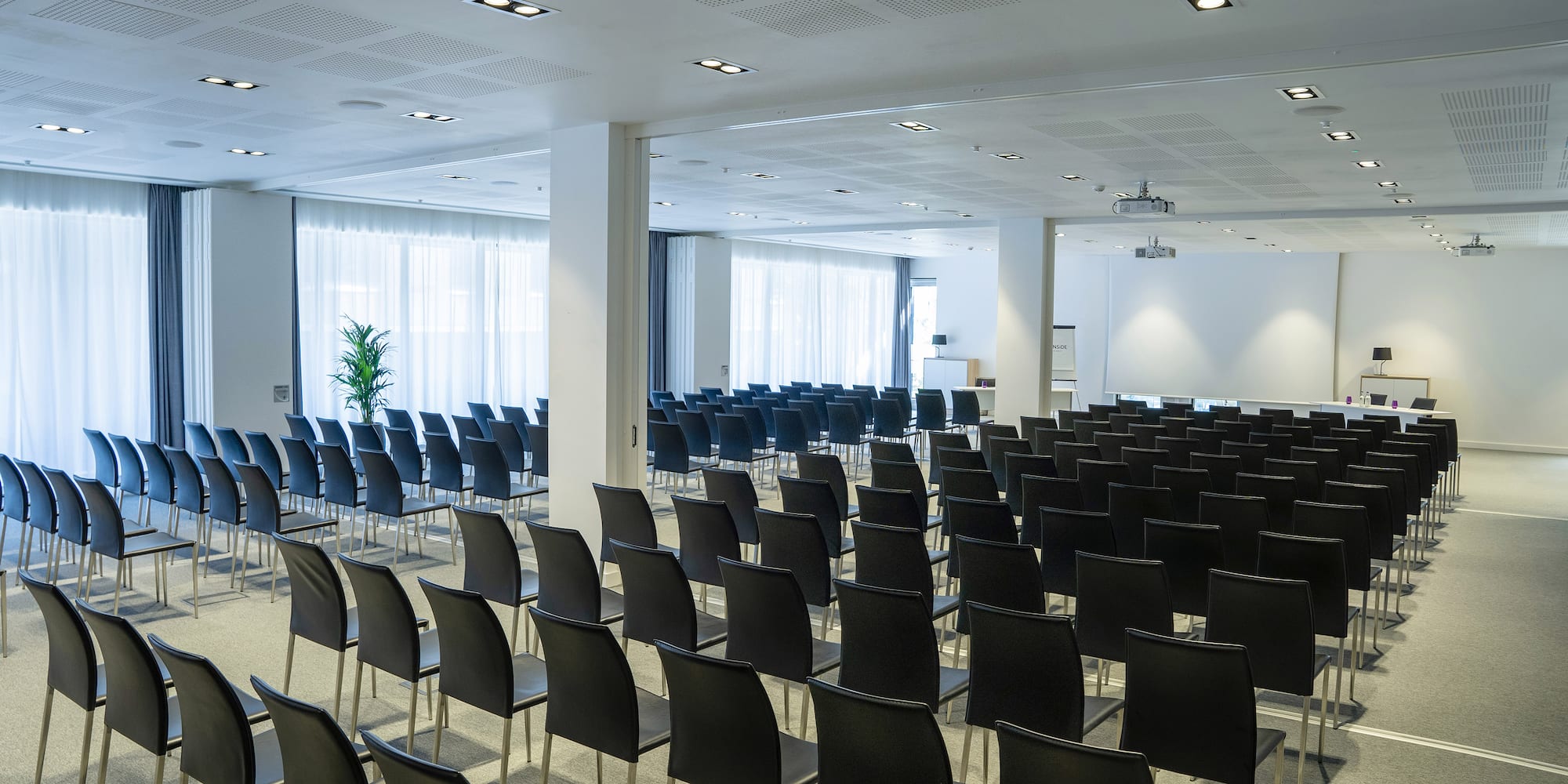 a room with rows of chairs