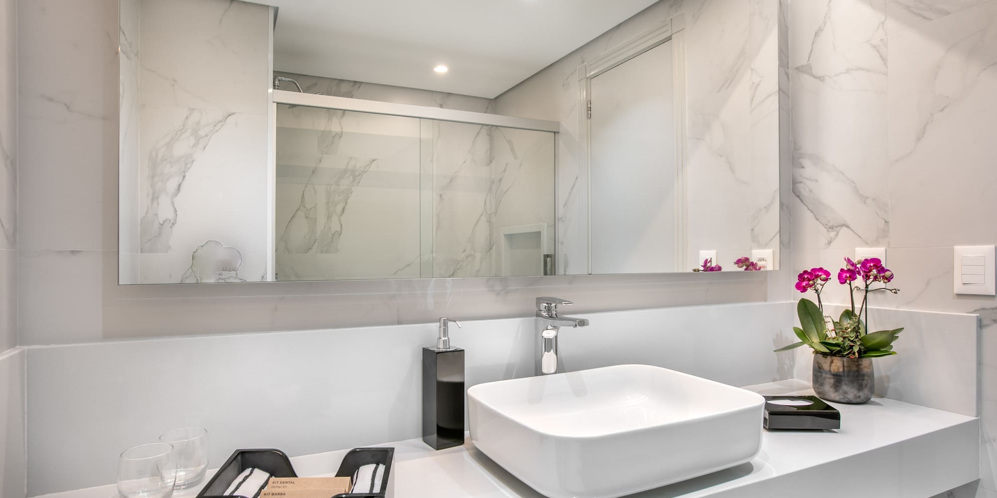 a bathroom with a sink and mirror