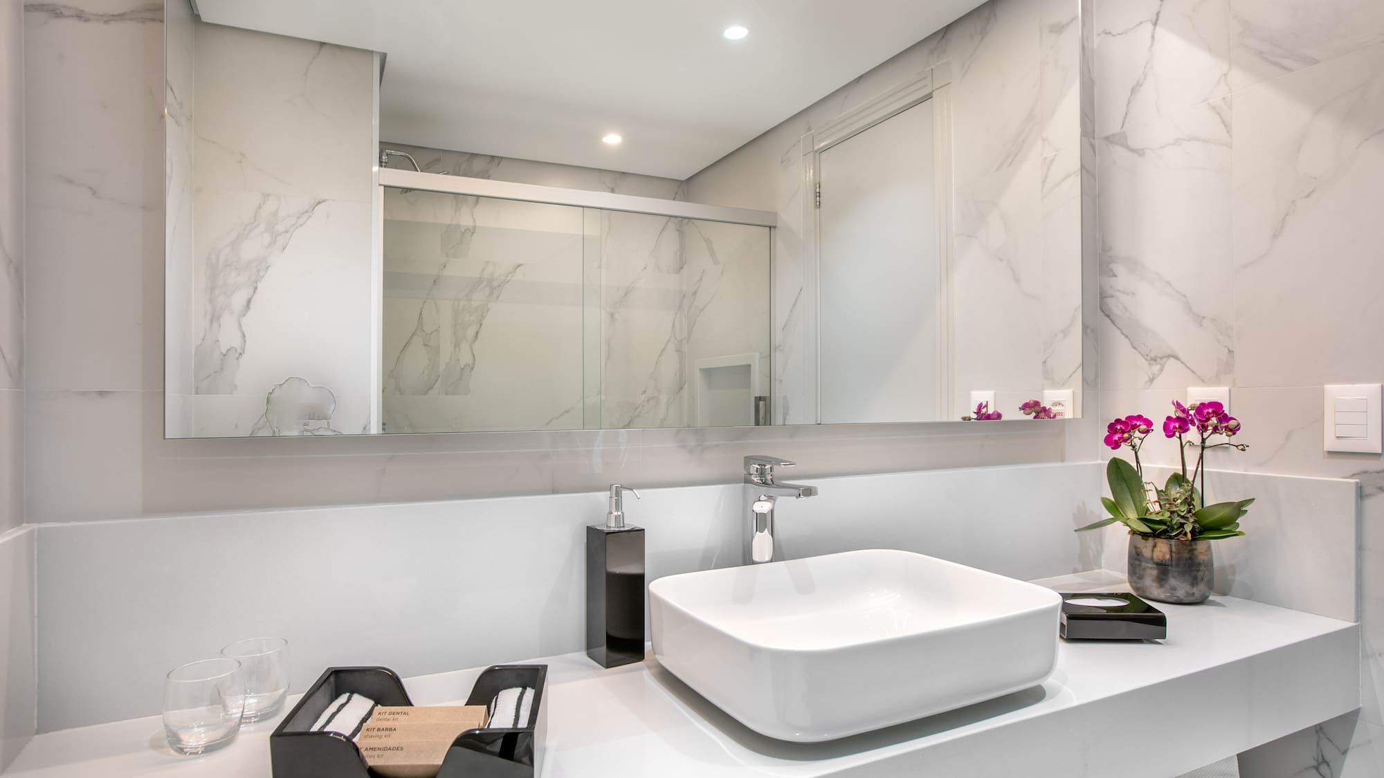 a bathroom with a sink and mirror