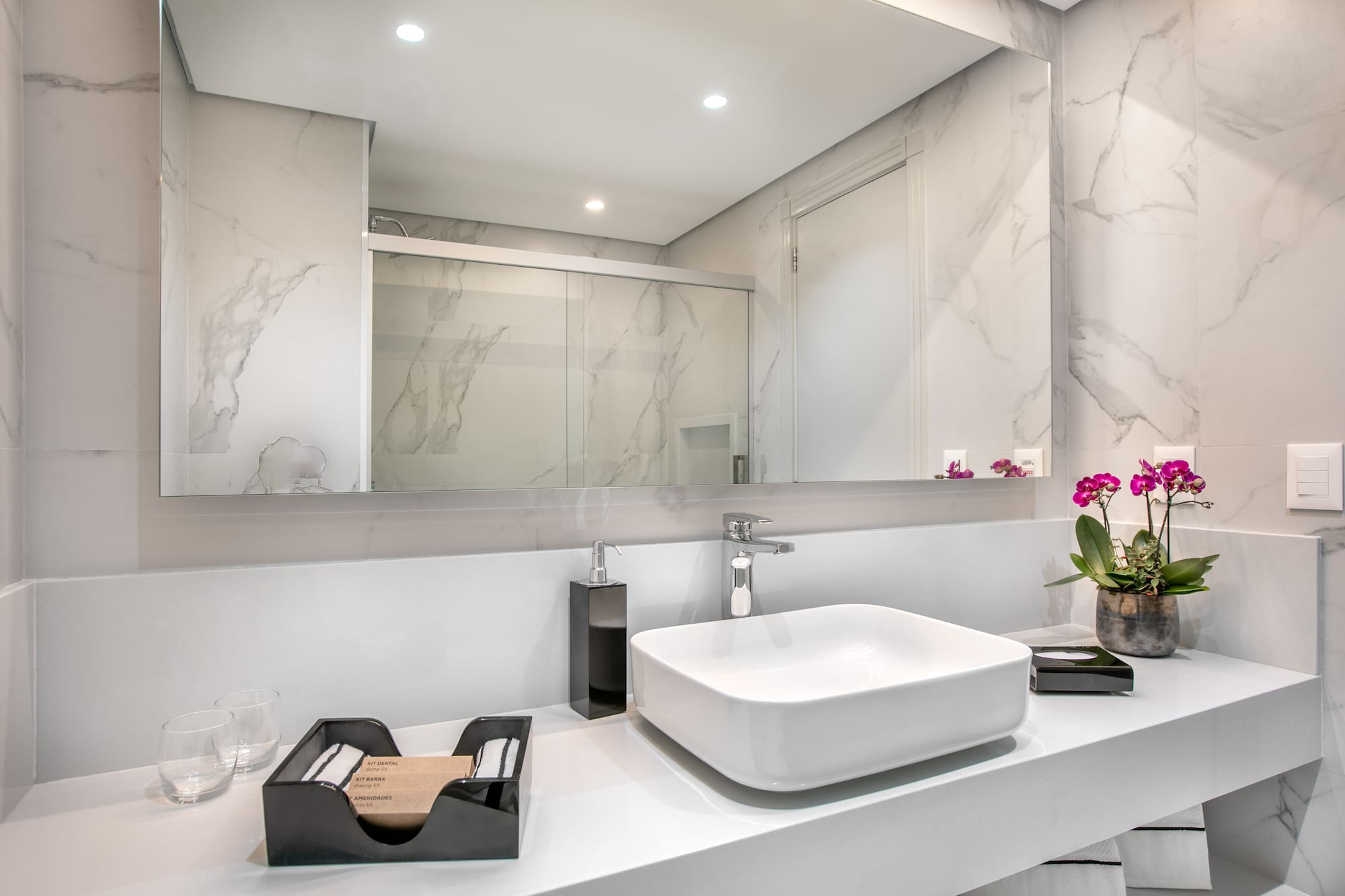 a bathroom with a sink and mirror