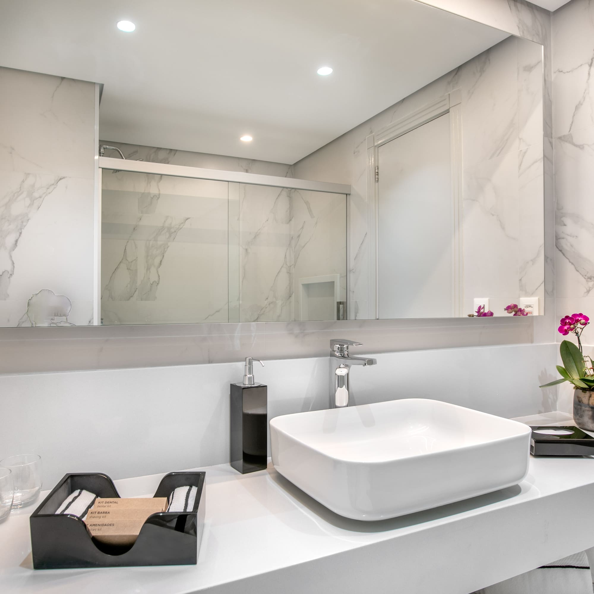 a bathroom with a sink and mirror