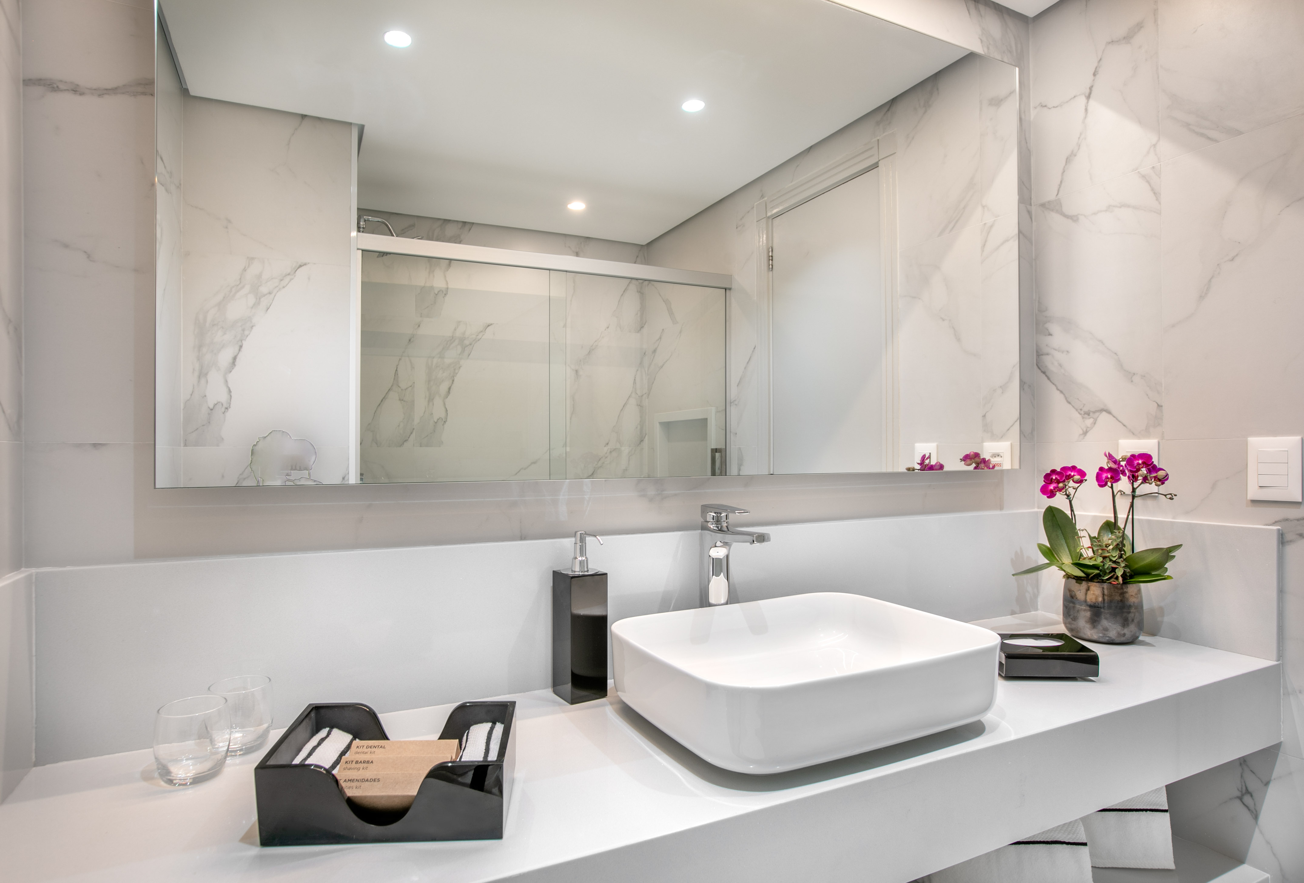 a bathroom with a sink and mirror