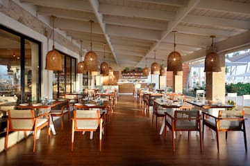 a restaurant with tables and chairs