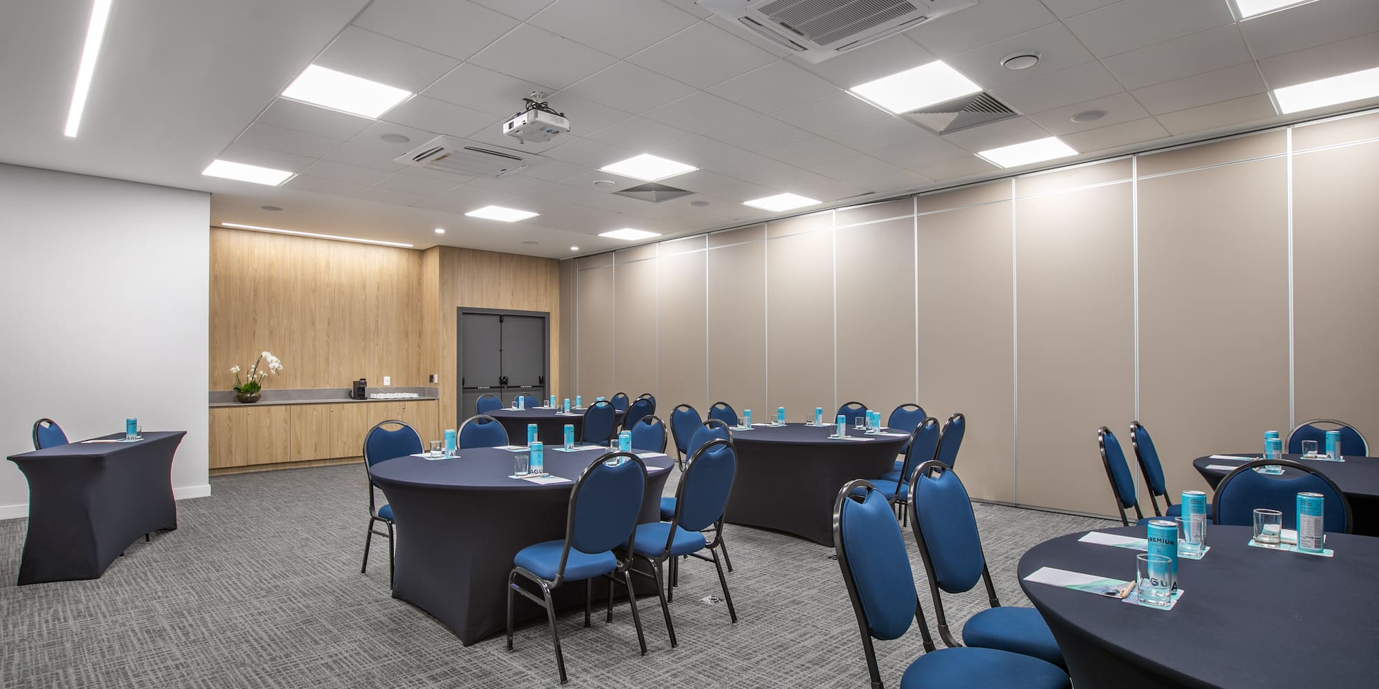 a room with round tables and chairs