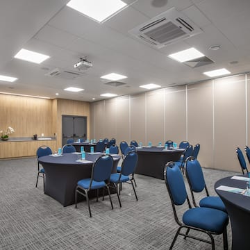 a room with round tables and chairs