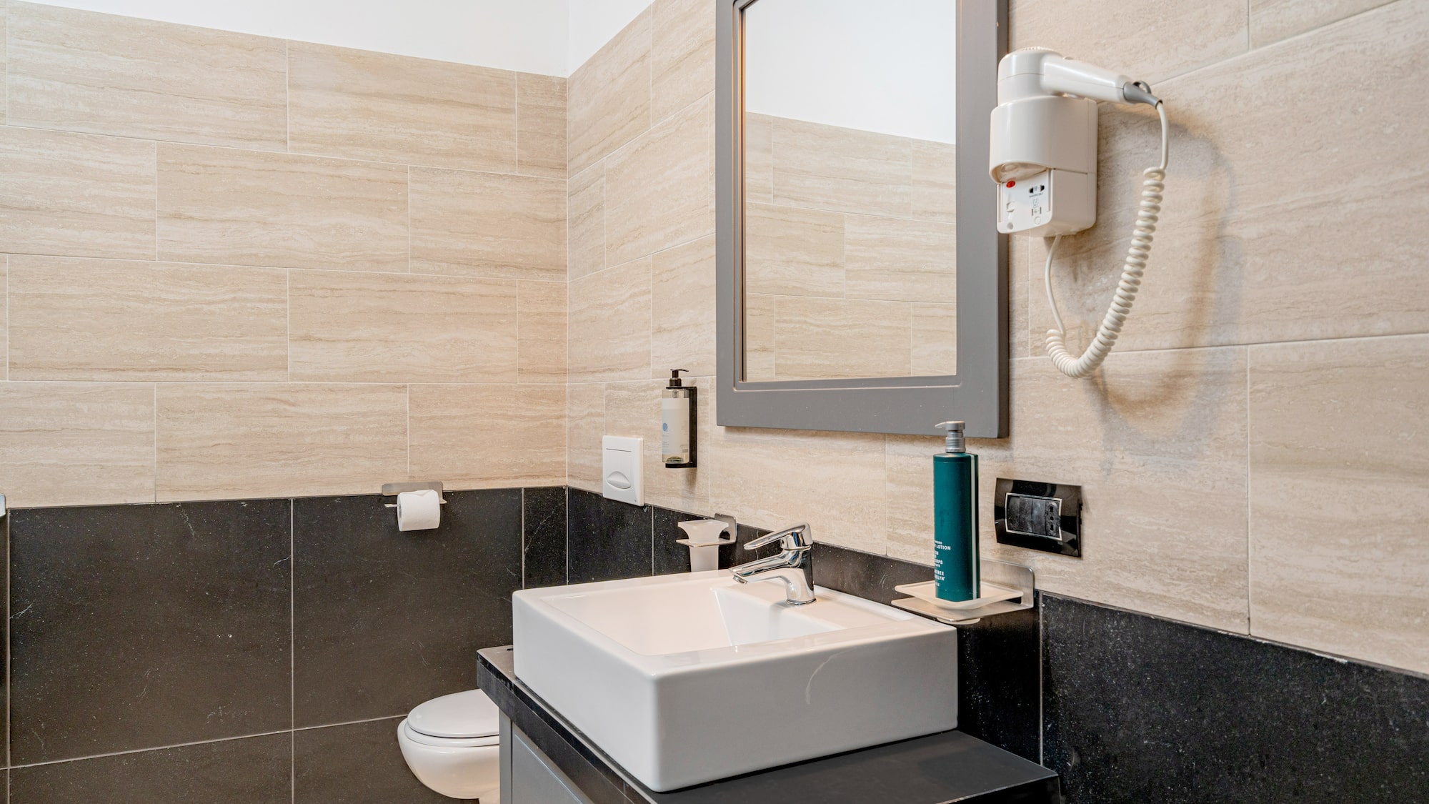 a bathroom with a mirror and sink