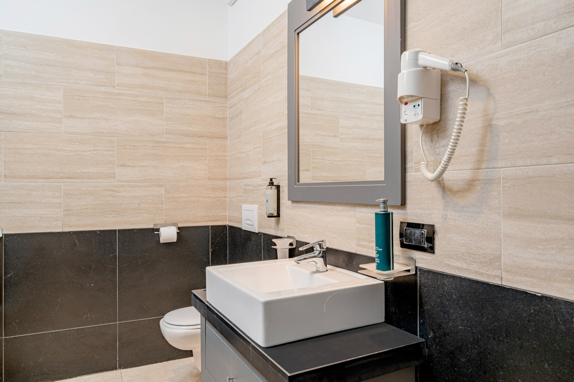 a bathroom with a mirror and sink