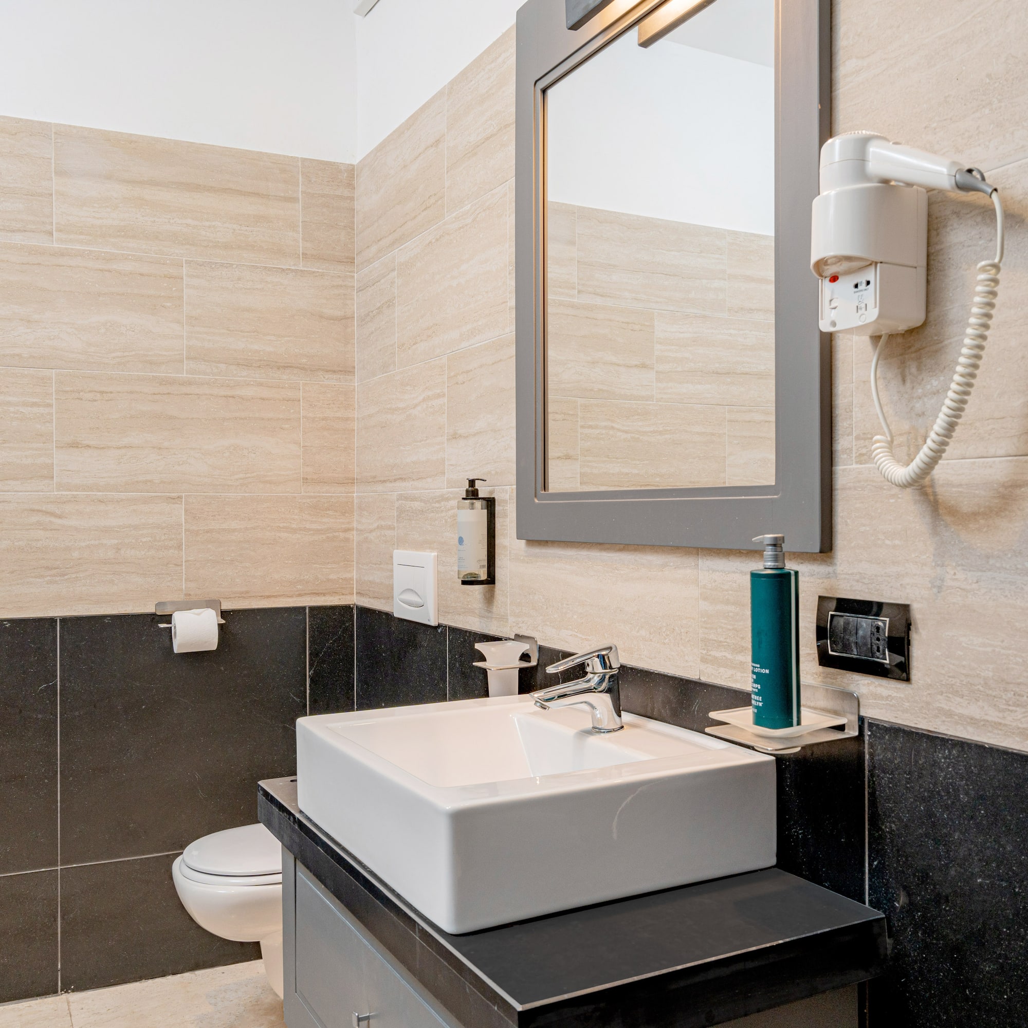 a bathroom with a mirror and sink