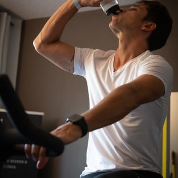 a man drinking from a bottle