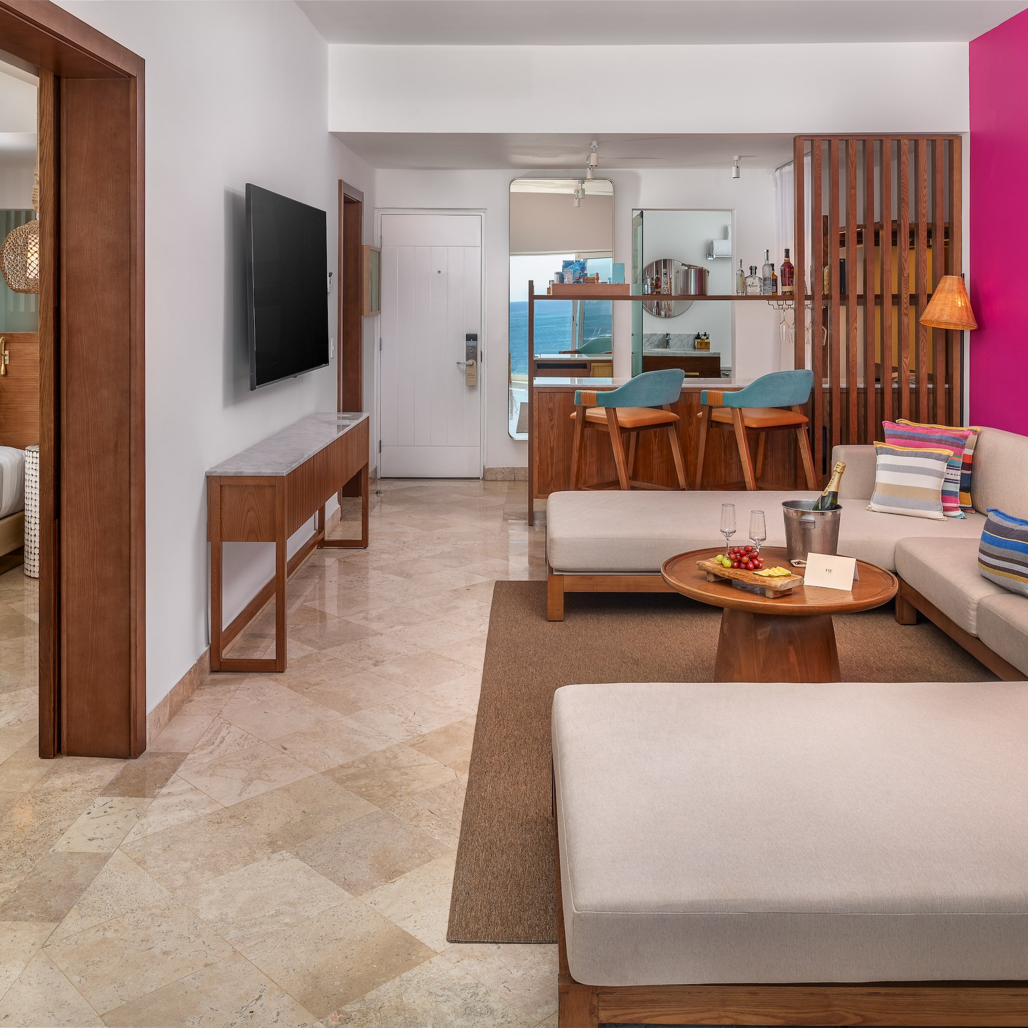 a living room with a television and couches