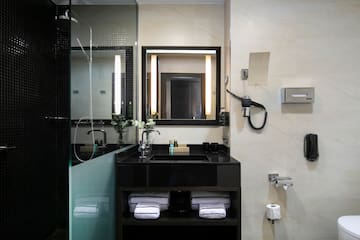 a bathroom with a mirror and sink