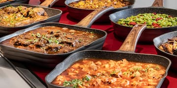 a group of pans with different types of food