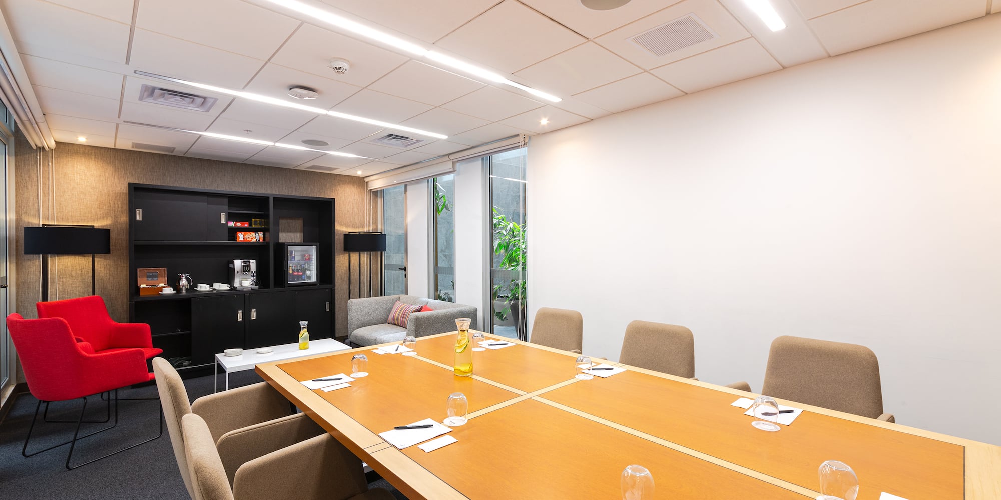 a conference room with a table and chairs
