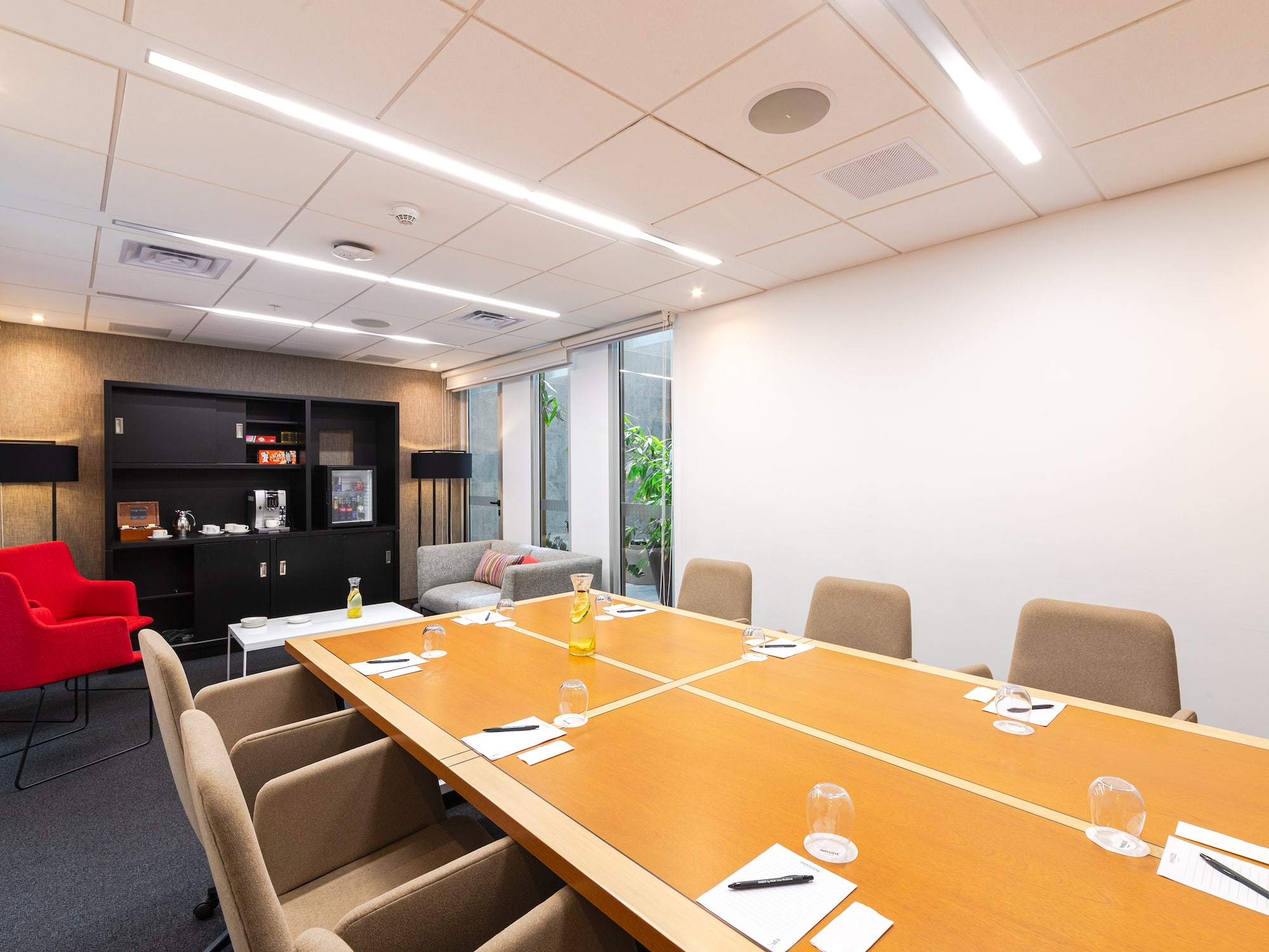 a conference room with a table and chairs