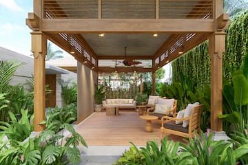a patio with a wood deck and a wood table and chairs