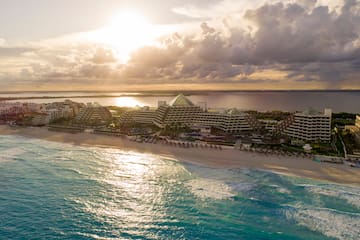a beach with buildings and water