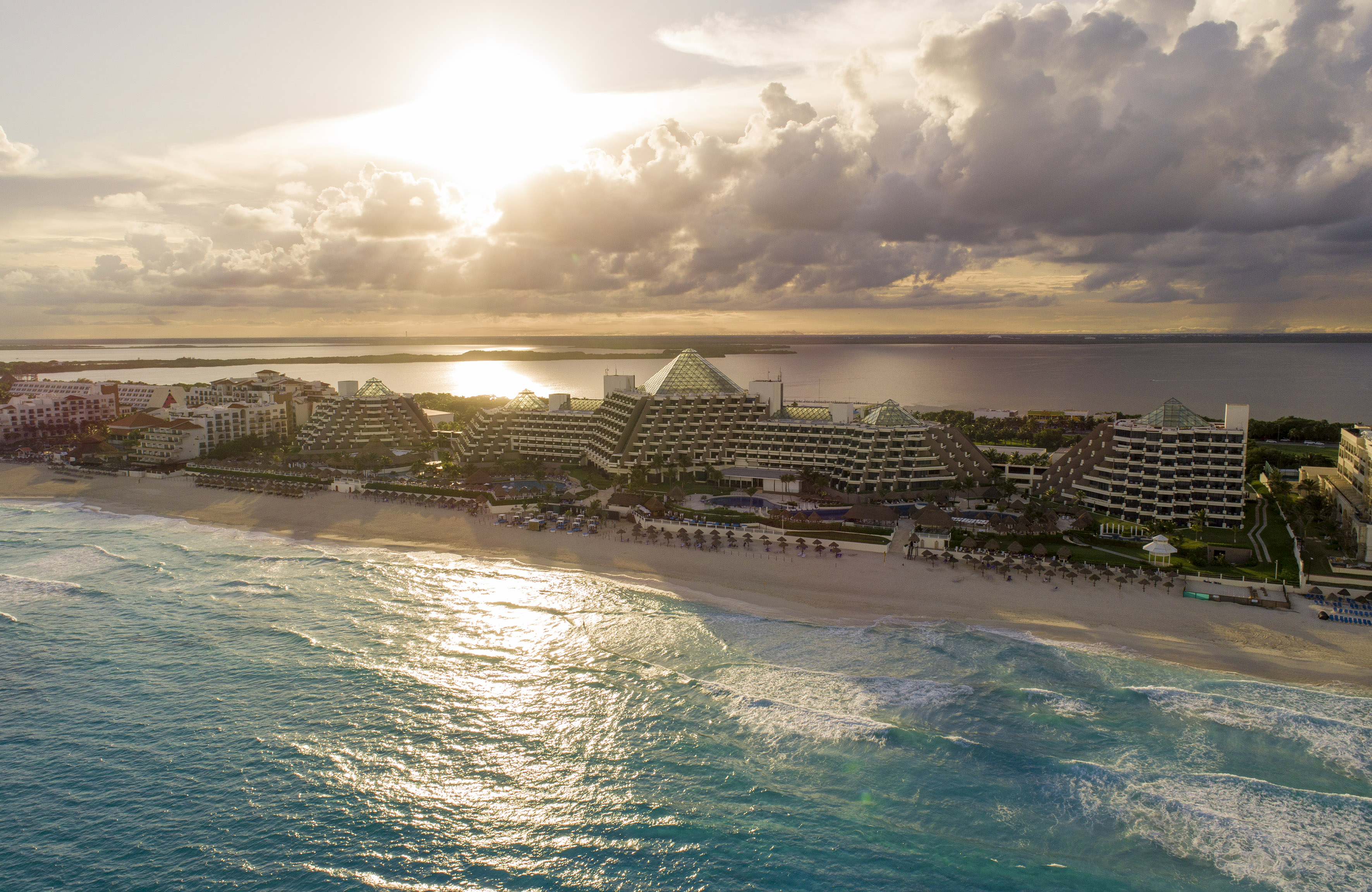 a beach with buildings and water