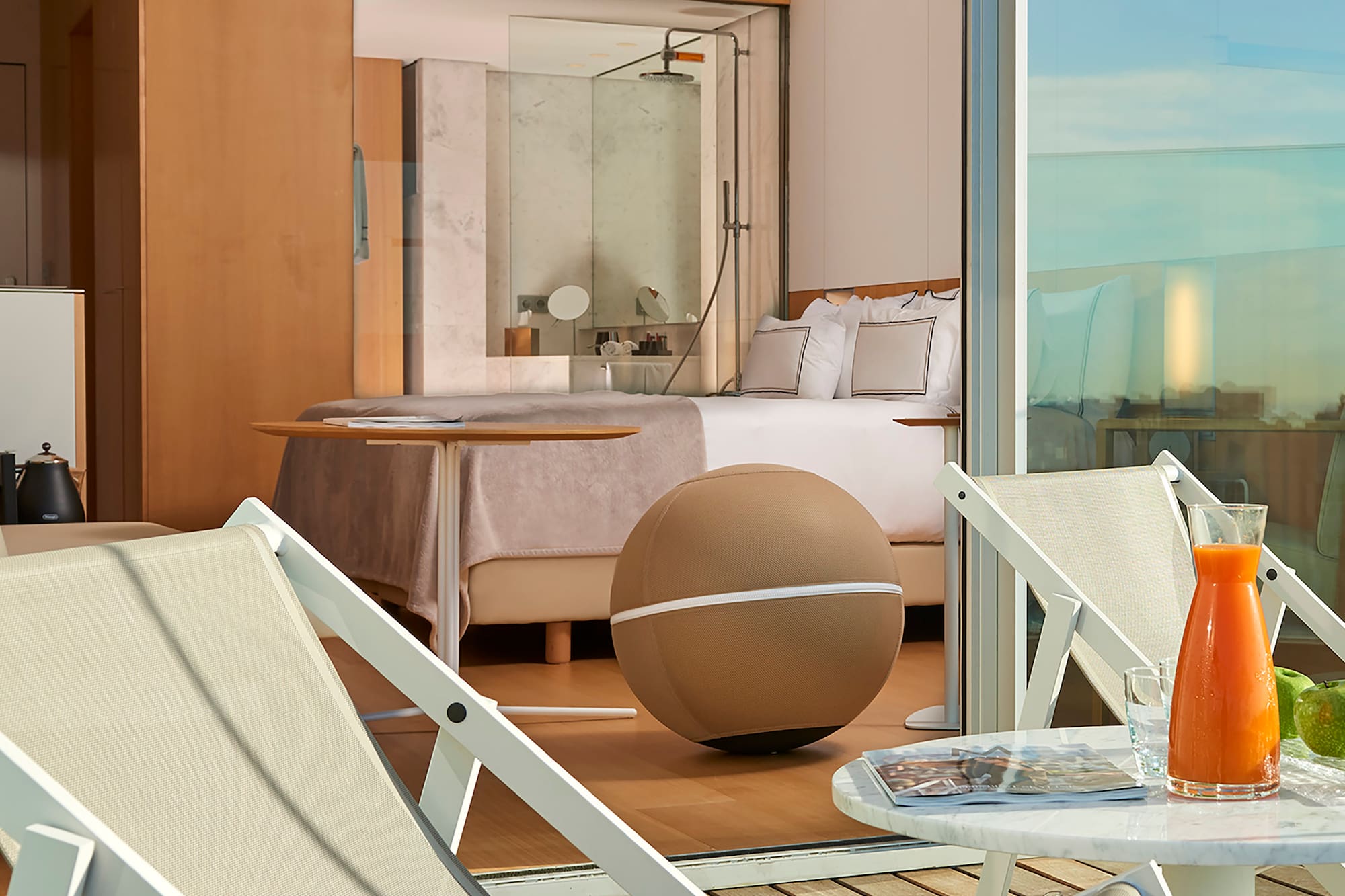 a chair and table on a balcony