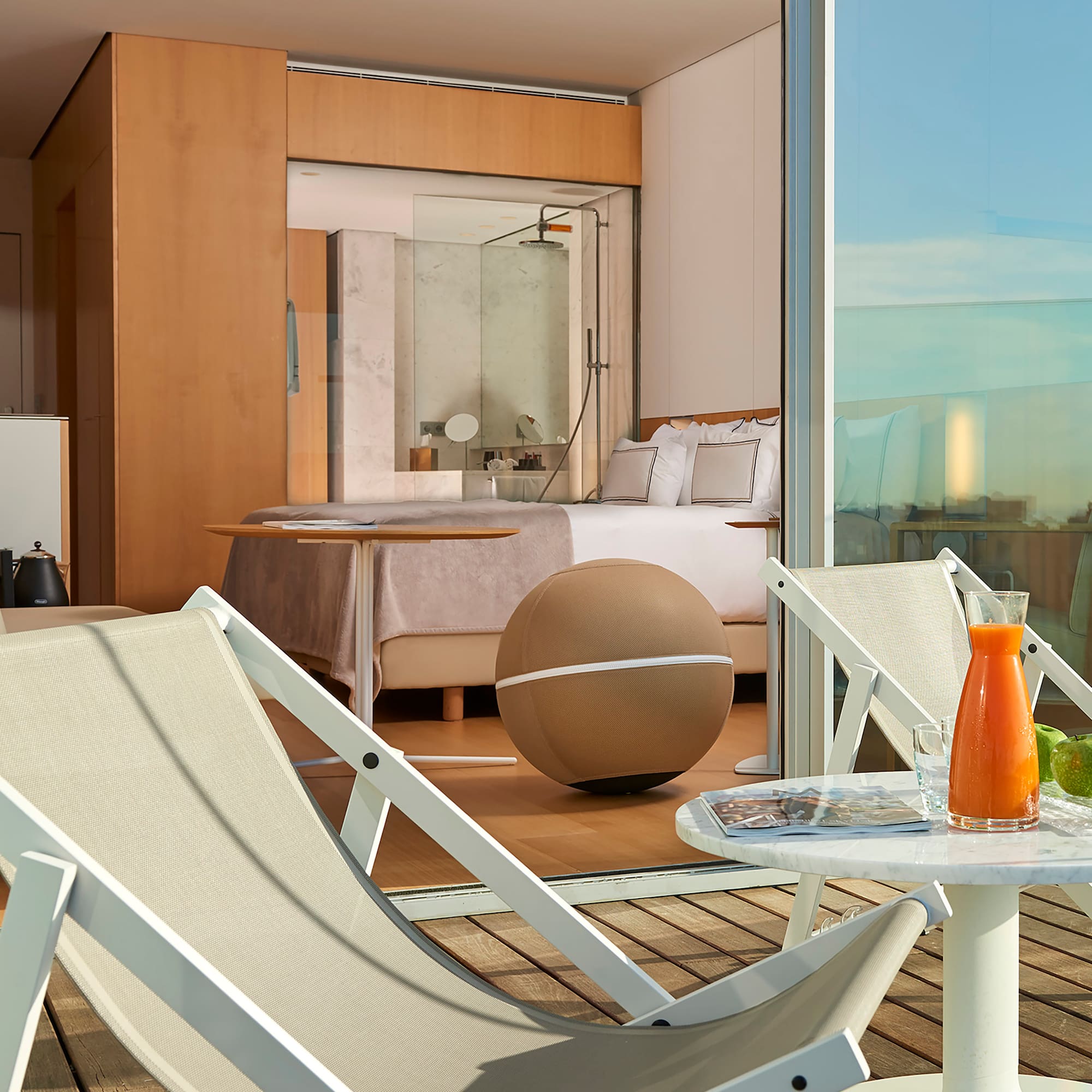 a chair and table on a balcony