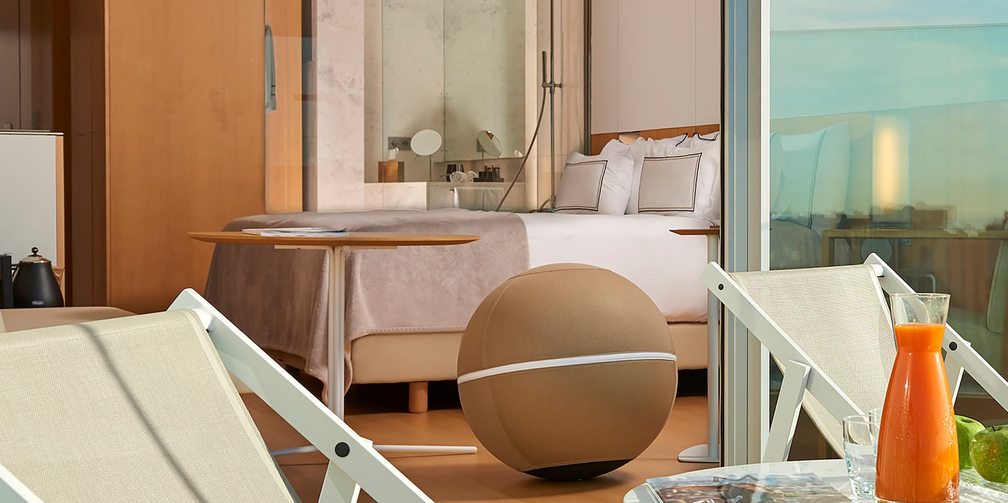 a chair and table on a balcony