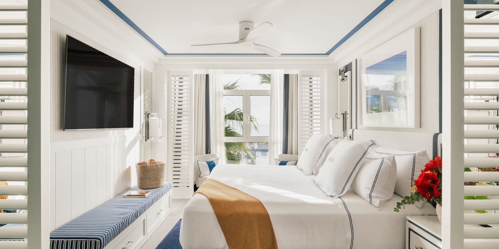 a bedroom with a bed and a television