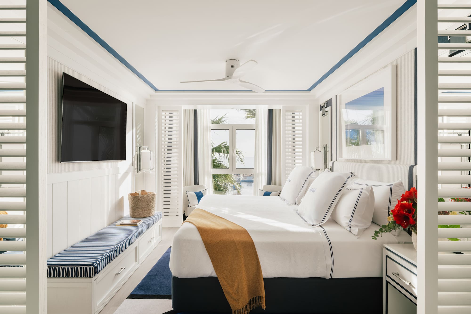 a bedroom with a bed and a television