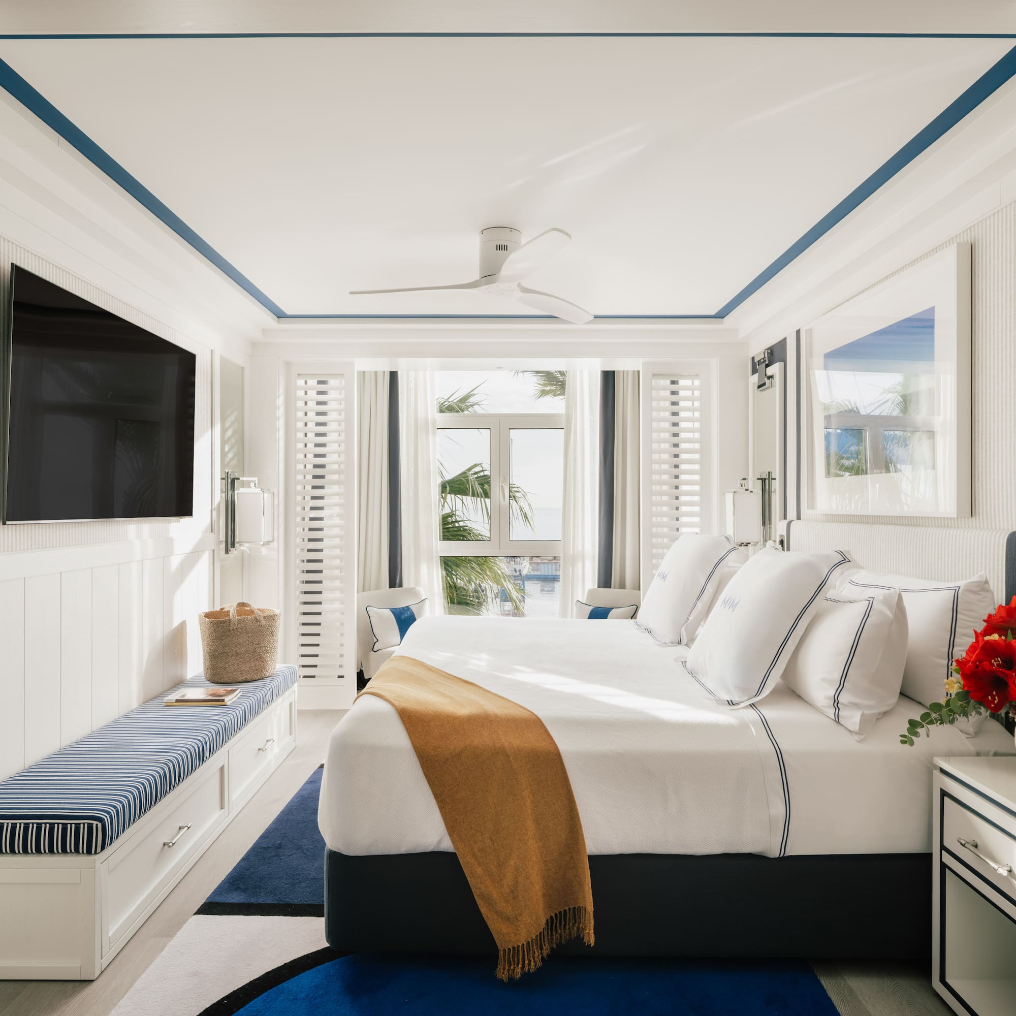 a bedroom with a bed and a television