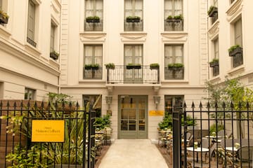 a building with a gate and tables